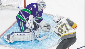  ?? Jason Franson The Associated Press ?? Shea Theodore gets a prime scoring chance in Game 3 against the Canucks but is foiled by goalie Jacob Markstrom. Theodore’s play is among the reasons the Golden Knights have a 3-1 lead in the series.