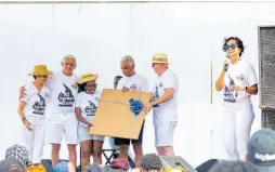  ?? ?? Lisa Lake (right), CEO, Lake Group, expresses thanks for 32 years of service to Valda Ormsby (centre) following the presentati­on of a retirement gift by (from left) Ann Ventura, Richard Lake, Michael Lake and Frank Ventura during the Lake Group fun day.