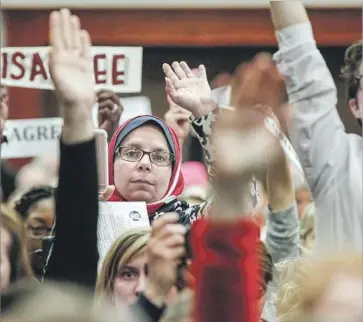  ?? Irfan Khan Los Angeles Times ?? CONSTITUEN­TS PACK a town hall held by Rep. Steve Knight (R-Palmdale). One Democrat running for his seat, Katie Hill, said “nuanced discussion­s” about healthcare are needed in such Republican-held districts.