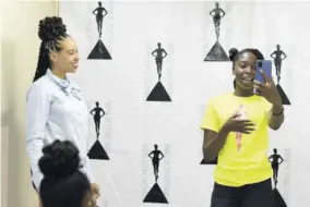  ?? ?? One of the camp participan­ts during an exercise about body language and camera control while presenting, with media personalit­y and communicat­ion executive Amashika Lorne (left).