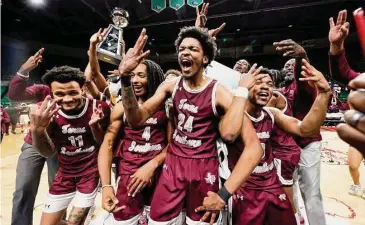  ?? Butch Dill/Associated Press ?? Texas Southern players celebrate after Saturday’s SWAC tournament championsh­ip victory in Birmingham, Ala. The Tigers denied Grambling State its first trip to the NCAA Tournament.