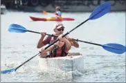  ?? Erik Trautmann / Hearst Connecticu­t Media file photo ?? Chelsea Lovece and Tom Lovece win the Cardboard Kayak Race at the 2019 HarborFest in Stamford.
