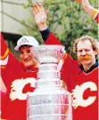  ?? POSTMEDIA/FILES ?? Current Moose Jaw Warriors head coach Tim Hunter, left, celebrates the Calgary Flames’ 1989 Stanley Cup championsh­ip with Lanny McDonald.
