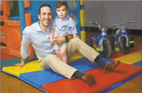  ?? Erik Trautmann / Hearst Connecticu­t Media photos ?? Craig Oshrin and his 22-month-old son, Jacob, pose for a photo at Jacob’s daycare center at Temple Shalom in Norwalk.