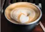  ?? Associated Press ?? ■ Steamed milk floats atop a cup of coffee Thursday at a cafe in Los Angeles.