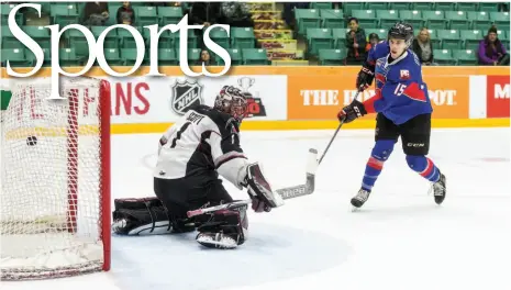  ?? CITIZEN PHOTO BY JAMES DOYLE ?? Prince George Cougars forward Brogan O’Brien scores on a penalty shot against Vancouver Giants goaltender Todd Scott on Saturday night at CN Centre. The Cougars beat the Giants 6-2 after a 5-2 loss on Friday.