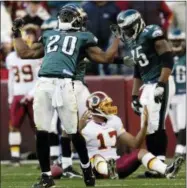  ?? NICK WASS — ASSOCIATED PRESS ?? Eagles safety Brian Dawkins celebrates a tackle of Redskins quarterbac­k Jason Campbell. Dawkins will be inducted into the Hall of Fame this weekend.
