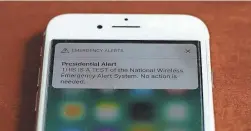  ?? PAUL SANCYA/AP ?? Cellphones will be part of the emergency alert test.