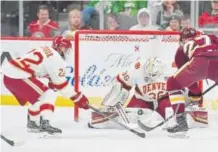  ?? Brett Groehler, Special to The Denver Post ?? University of Denver goalie Tanner Jaillet makes one of his 25 saves Friday, blocking this shot by Minnesota Duluth forward Ryan Tufte at the Xcel Energy Center in St. Paul, Minn.