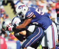  ?? Gary Wiepert / Associated Press ?? Buffalo Bills defensive end Jerry Hughes sacks New England Patriots’ Tom Brady in 2014.