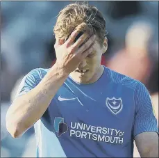  ??  ?? ANGUISH Sean Raggett’s disappoint­ment is clear to see