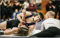  ?? NATE HECKENBERG­ER — FOR MEDIANEWS GROUP ?? Paul James Pebly of Kennett finishes a headlock against Great Valley’s Nick Mort for the fall at 152pounds.