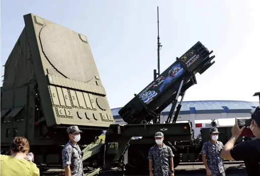  ?? The Yomiuri Shimbun ?? An Air Self-Defense Force missile launcher and radar equipment to intercept ballistic missiles are seen in Takashima, Shiga Prefecture, on Aug. 7.