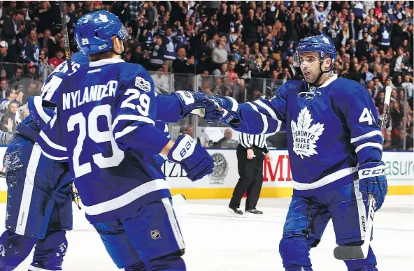  ?? — GETTY IMAGES FILES ?? Auston Matthews, left, and William Nylander celebrate a Maple Leafs goal with Nazim Kadri during recent NHL action. Kadri’s solid campaign and the Leafs’ rookie class, including Matthews and Nylander, have combined to vault Toronto into playoff...