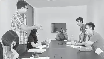  ??  ?? Albert (centre) presides over a debate as an opposition team member argues a point with the supporting team.