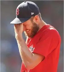  ?? MATT sTOnE pHOTOs / HErAld sTAFF ?? DON’T BLAME HIM: Red Sox lefty Chris Sale reacts after being taken out in the fourth inning against the Rays at Fenway Park on Monday. Below, Alex Verdugo’s adventure in center field didn’t start well, this time allowing a triple to Wander Franco in the first inning.