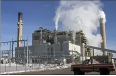  ?? NATALIE BEHRING — THE ASSOCIATED PRESS FILE ?? Carbon dioxide and other pollutants billows from stacks at the Naughton Power Plant, near where Bill Gates company, Terrapower plans to build an advanced, nontraditi­onal nuclear reactor, on Jan. 12 in Kemmerer, Wyo.