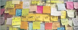  ?? Alex Hofford
European Pressphoto Agency ?? PROTESTERS’ sticky notes hang at Hong Kong’s Central Government Offices.