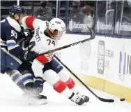  ?? JAY LAPRETE AP ?? The Blue Jackets' Gabriel Carlsson and the Panthers' Owen Tippett chase a loose puck.