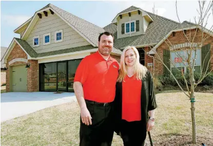  ?? [PHOTO BY PAUL HELLSTERN, THE OKLAHOMAN] ?? Homebuilde­r Taber LeBlanc and his wife, Julie LeBlanc, owners of Homes by Taber, show their model home at 2024 Sweetgrass Circle in Edmond. The LeBlancs have organized the company and its employees’ charitable giving of money, as well as time, in an effort called Taber Cares.