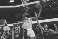  ?? Justin Ford, USA TODAY Sports/Reuters ?? HOUSTON Rockets guard James Harden (13) goes to the basket against Memphis Grizzlies forward Kyle Anderson (1) during the first half at FedExForum.