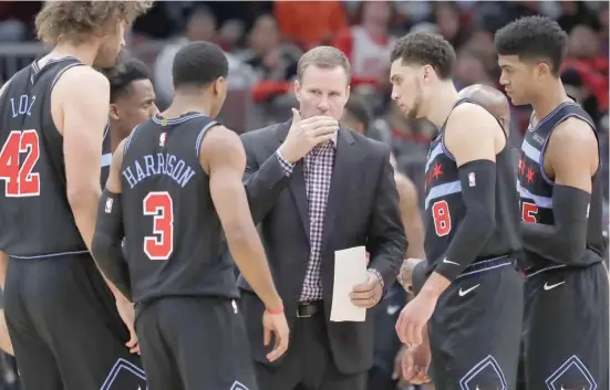  ?? NAM Y. HUH/AP ?? Then-Bulls coach Fred Hoiberg talks with his players during a break in play last month. Vice president John Paxson said the team needed a change ‘‘to find a spirit.’’