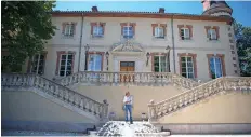  ?? —AFP photos ?? Caroline Pozzo di Borgo poses in front of the Forbin castle as the building prepares to host a street art exhibition in Marseille, southern France.