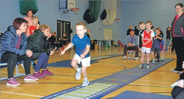  ??  ?? Under seven years champion Ethan Kerr from Tighnabrua­ich takes on the triple jump, an event which he won. 06_a04athleti­c01