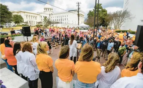  ?? MICKEY WELSH/THE MONTGOMERY ADVERTISER ?? Hundreds gather at a rally in Montgomery, Alabama, in support of in vitro fertilizat­ion legislatio­n on Feb. 28. The recent ruling by the Alabama Supreme Court that frozen embryos can be considered children has led to halting IVF treatments in the state.