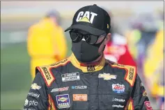  ?? CHRIS GRAYTHEN — GETTY IMAGES ?? Corning’s Tyler Reddick, driver of the No. 8 Chevrolet, stands on the grid prior to the NASCAR Cup Series race at Las Vegas Motor Speedway on Sunday in Las Vegas. Reddick finished 38th on Sunday.