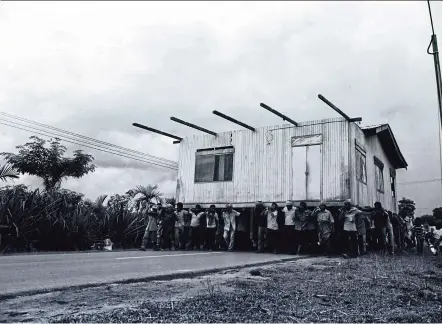  ?? — Photos: Ilham Gallery ?? An image sohwing the tradition of Angkat Rumah (moving house) in Terengganu, circa 1970s, from the collection of Wang Fook Seek.