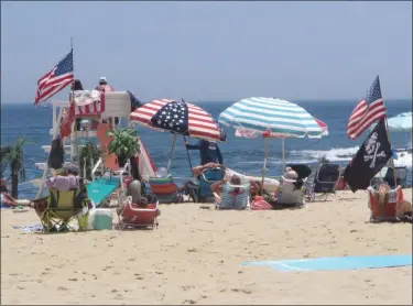  ?? WAYNE PARRY — THE ASSOCIATED PRESS ?? Flags line the beach in Belmar, N.J., on June 28, 2020.