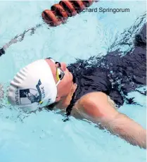  ??  ?? Kayla Hassard looking for a quick turn during the girls’ 16-19 200m individual medley