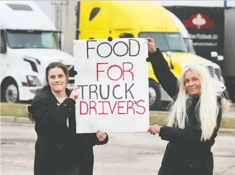  ?? DAN JANISSE ?? Jessica Knight-moodrey, left, and her mother Vikki Knight were at the Petro Pass Truck Stop on County Road 46 in Oldcastle on Friday, where they were offering free meals to truckers. Along with volunteers, the pair is preparing meals at a local diner to hand out.