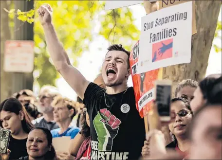  ?? Photograph­s by Maria Alejandra Cardona Los Angeles Times ?? IAN BURKE JAMESON joins a rally against Atty. Gen. Jeff Sessions, in Los Angeles for a speech, and “zero tolerance” immigratio­n rules.