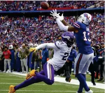  ?? AP PHOTO ?? Buffalo Bills’ Gabe Davis catches a touchdown pass as Minnesota Vikings’ Akayleb Evans tries to defend in the first half of an NFL football game on Sunday, Nov. 13, 2022 (November 14 in Manila), in Orchard Park, New York.