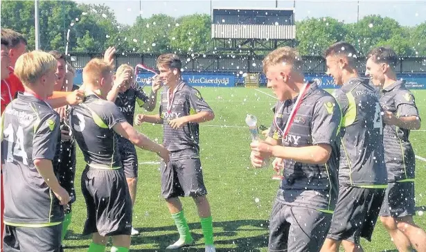  ??  ?? Bridgend College players celebrate their success