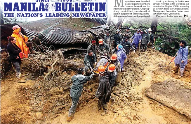  ?? (JJ Landingin) ?? BAGUIO MUDSLIDES – A body is retrieved at the site of a mudslide in Baguio City Sunday. Several other mudslides were reported in Baguio.