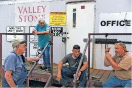  ?? MICHAEL NOBLE JR./FOR THE WASHINGTON POST ?? From left, Johnny and Donna Webb, Trent Sewell and Jim Boatright catch up at the end of their shift at Valley Stone Quarry in Cameron, Okla. Finding enough workers has been a challenge, says co-owner Donna Webb.