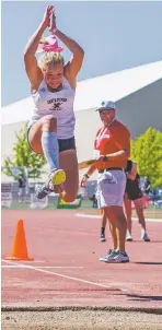  ??  ?? Santa Fe Prep sophomore Hayden Colfax makes her final leap Saturday in the triple jump at the Small-School Track and Field State Championsh­ips. Colfax nailed a 34 foot, 11 inch jump that won the title by 2½ inches.