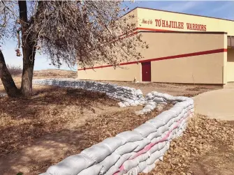  ?? SUSAN MONTOYA BRYAN/ASSOCIATED PRESS ?? A wall of sandbags protects To’Hajiilee Community School. The school on the Navajo Nation is just one of dozens funded by the U.S. Bureau of Indian Education that are in desperate need of repair or replacemen­t.