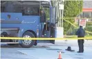  ?? AP ?? Investigat­ors look for evidence on a Greyhound bus after a passenger was killed Monday in Lebec, Calif.