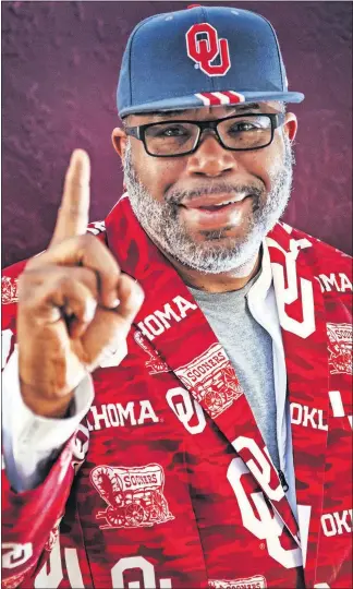  ?? [CHRIS LANDSBERGE­R/THE OKLAHOMAN] ?? Dwayne Doolittle, father of Oklahoma basketball player Kristian Doolittle, wears a flashy sports coat at Sooner games so his son's teammates can have a familiar face in the stands.