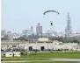  ?? ?? A US Air Force parachutin­g drill at its base in Okinawa.