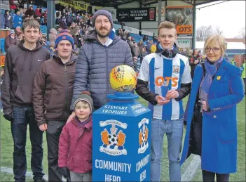  ??  ?? Graeme Johnston of Arran Youth Foundation­s joins Ross Dobson, who received the Community Hero award.