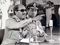  ??  ?? 1979: Egypt’s president Anwar Sadat makes remarks as vice-president Hosni Mubarak looks on in Cairo.