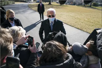  ?? EVAN VUCCI — THE ASSOCIATED PRESS FILE ?? President Joe Biden talks with reporters after arriving on the South Lawn of the White House, on Feb. 8, 2021, in Washington.
