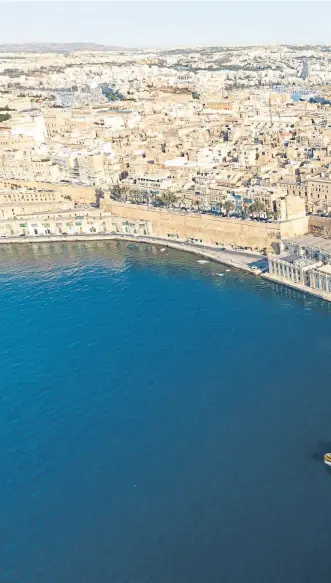  ?? ?? SHIMMERING SHOWCASE: Main picture, the Three Cities; above left, St John's Co-Cathedral in Valletta; below right, the capital’s waterfront.