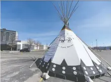  ?? CHRISTOPHE­R LANDRY ?? A Siksika Health Services teepee stands outside the new urban Indigenous vaccine clinic, which opened on Wednesday.