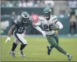  ?? MATT ROURKE - THE ASSOCIATED PRESS ?? File-This Oct. 6, 2019, file photo shows New York Jets’ Le’Veon Bell, right, rushing past Philadelph­ia Eagles’ Rodney McLeod during the first half of an NFL football game in Philadelph­ia.